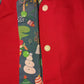 Christmas Dinosaur Reversible Waistcoat, fully reversible red or dinosaur front and back, popper fastening, available from newborn to age 10