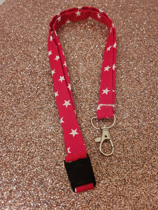 Red and white star thin lanyard with safety clip and clasp for badge/keys, perfect for festivals, conventions or work ID